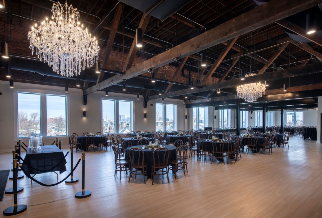 event room with chandeliers and dining tables