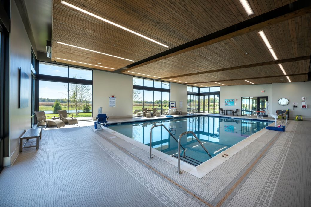 indoor pool with wood ceiling