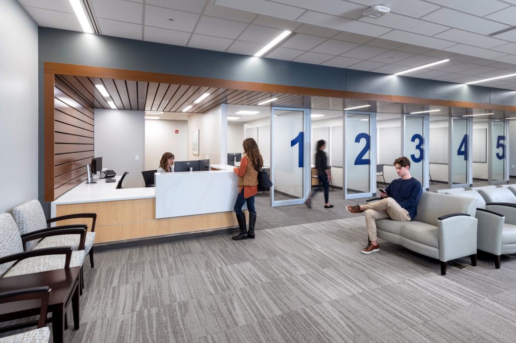 patient checking in with receptionist