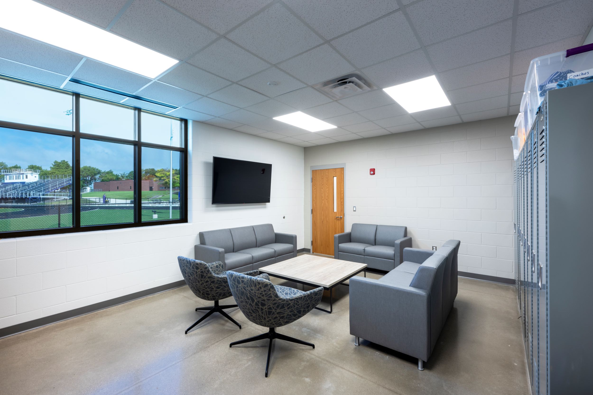 staff lounge with view of track and field