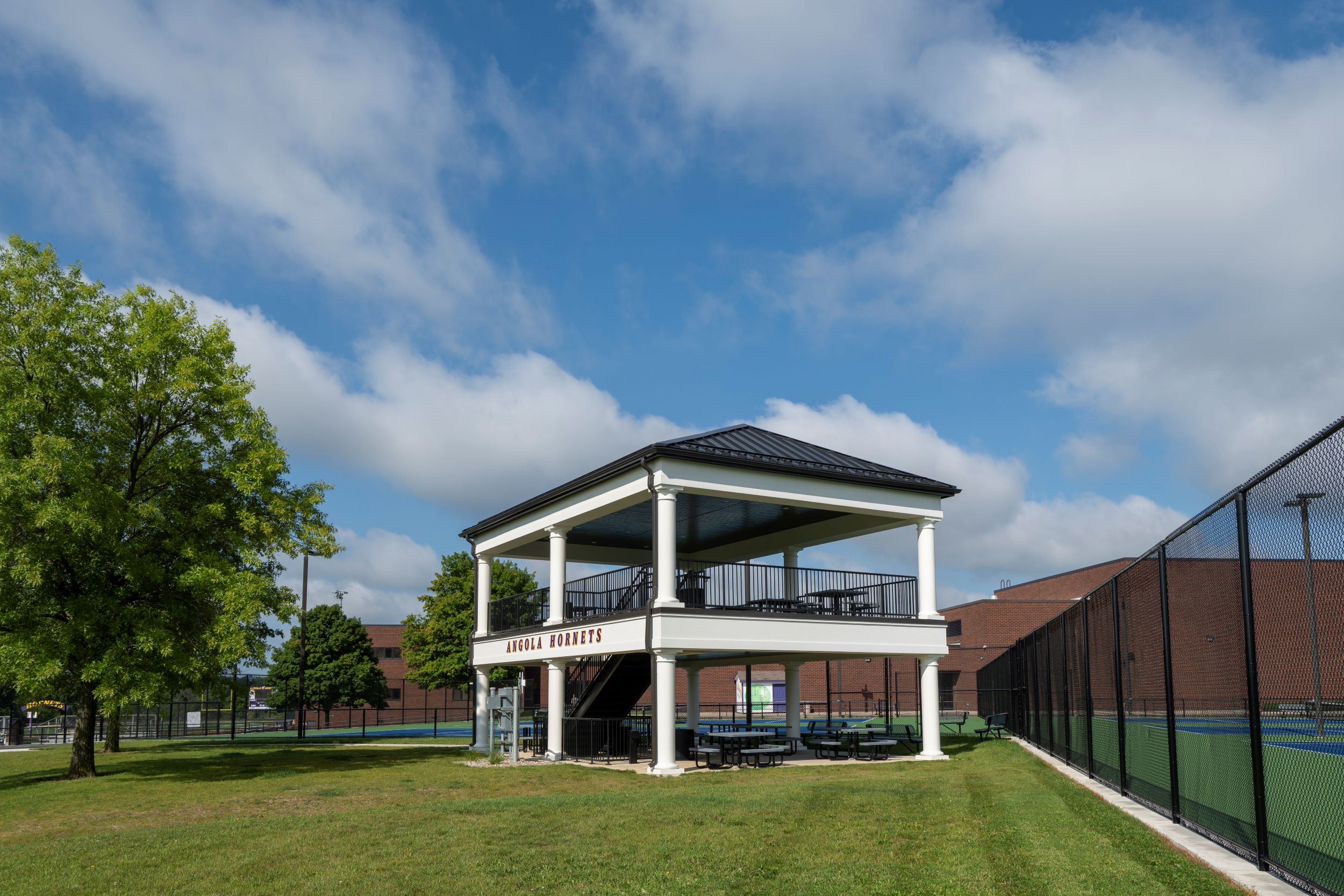 spectator structure next to tennis courts