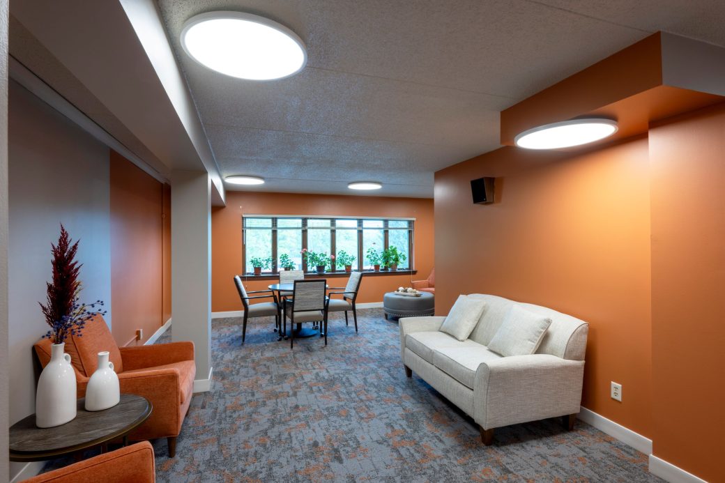 lounge area with orange accents